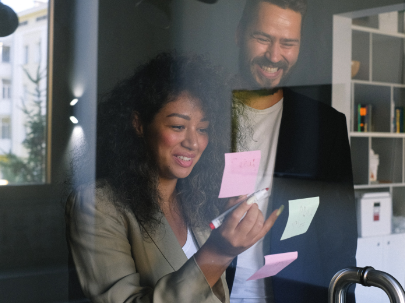 young-woman-working-on-laptop-smiling.png